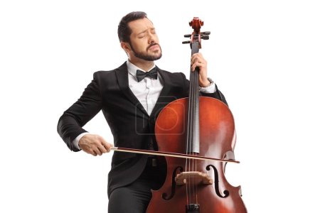 Photo for Male musician in a black suit and bow-tie performing with a cello isolated on white background - Royalty Free Image