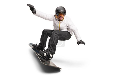 Téléchargez les photos : Homme chevauchant un snowboard isolé sur fond blanc - en image libre de droit