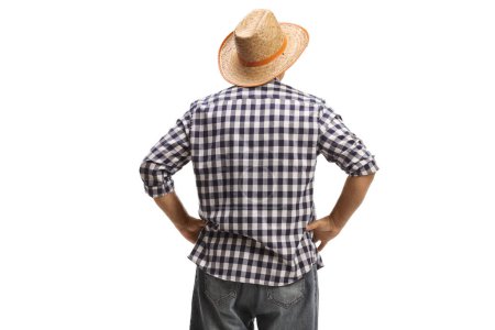 Foto de Vista trasera de un granjero con sombrero de paja aislado sobre fondo blanco - Imagen libre de derechos