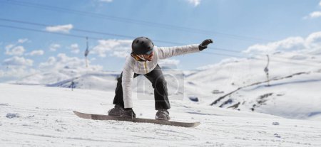 Photo for Man gliding with a snowboard on a snowy mountain - Royalty Free Image