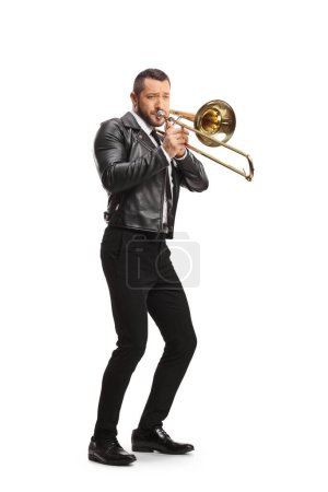 Téléchargez les photos : Full length shot of a guy playing a trombone isolated on white background - en image libre de droit