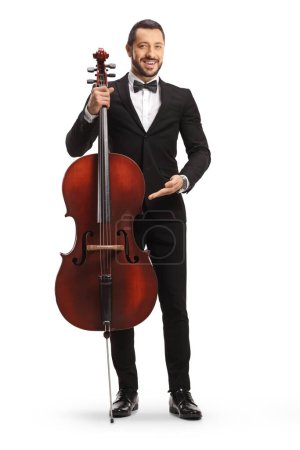 Photo for Full length portrait of a male artist posing with a cello isolated on white background - Royalty Free Image