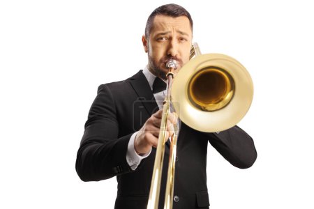 Téléchargez les photos : Portrait of a male musician playing a trombone isolated on white background - en image libre de droit