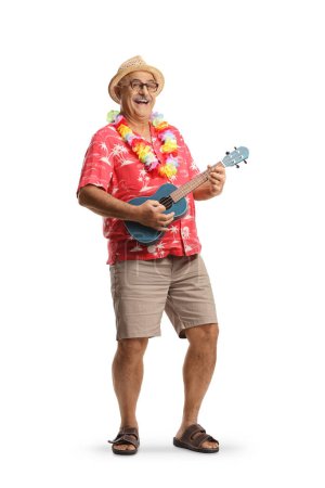 Téléchargez les photos : Full length portrait of a cheerful mature man playing ukulele instrument isolated on white background - en image libre de droit