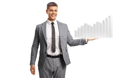 Photo for Young man in suit and tie smiling and holding a bar chart isolated on white background - Royalty Free Image