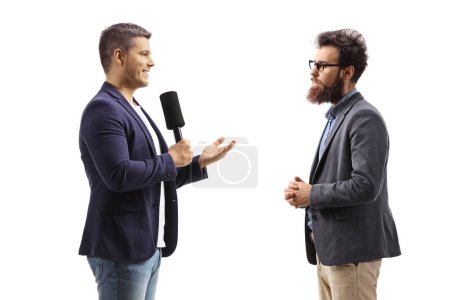 Foto de Journalist with a microphone talking to a bearded man isolated on white background - Imagen libre de derechos