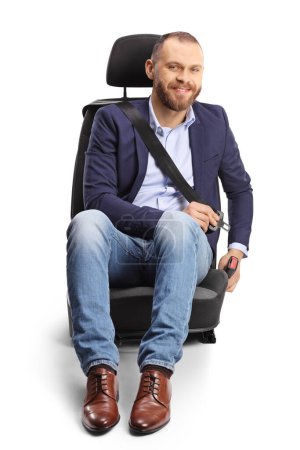 Téléchargez les photos : Male passenger putting on a seat belt in a car seat and smiling isolated on white background - en image libre de droit