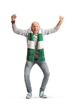 Téléchargez les photos : Full length portrait of a bald man cheering with a green and white scarf isolated on white background - en image libre de droit