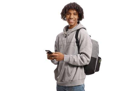 Photo for Young african american male student using a smartphone and smiling isolated on white background - Royalty Free Image