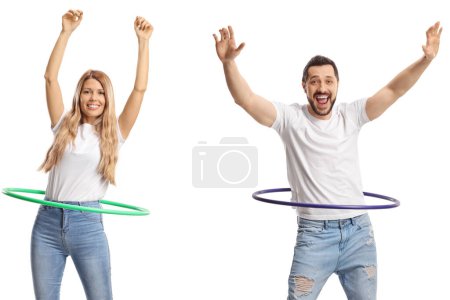 Photo for Cheerful young man and woman spinning hula hoops isolated on white background - Royalty Free Image