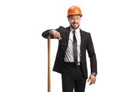 Photo for Businessman with a helmet standing with a wooden stick isolated on white background - Royalty Free Image