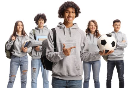 Téléchargez les photos : African american male student holding a football and other students standing behind isolated on white background - en image libre de droit