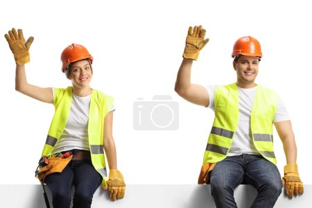 Photo for Male and female builders sitting on a panel and waving isolated on white background - Royalty Free Image