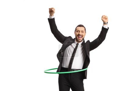Photo for Young happy businessman spinning a hula hoop isolated on white background - Royalty Free Image