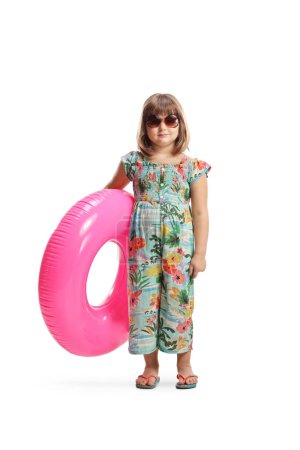 Photo for Little girl wearing sunglasses and holding a pink rubber swimming ring isolated on white background - Royalty Free Image