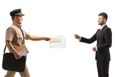 Photo for Profile shot of a mailman delivering a letter to a businessman isolated on white background - Royalty Free Image