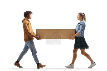 Photo for Caucasian woman and a young african american guy carrying a cardboard box togeather isolated on white background - Royalty Free Image