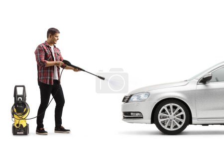 Photo for Full length shot of a man washing a car with a pressure washer machine isolated on white background - Royalty Free Image