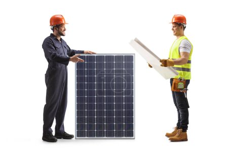 Photo for Worker presenting a solar panel to a contractor isolated on white background - Royalty Free Image