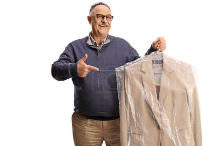 Photo for Mature man holding suit from dry cleaners and pointing isolated on a white backgroun - Royalty Free Image