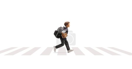 Photo for Schoolboy running on a pedestiran crossing isolated on white background - Royalty Free Image
