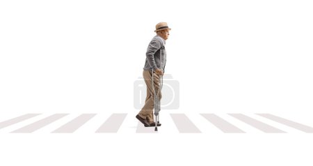 Photo for Elderly man walking with crutches on a pedestrian crossing isolated on white background - Royalty Free Image