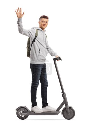 Photo for Generation z male riding an electirc scooter and waving at camera isolated on white background - Royalty Free Image