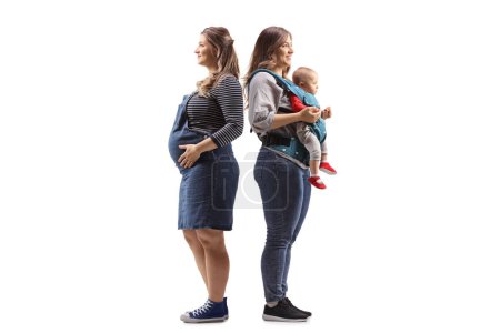 Foto de Foto de perfil completo de una mujer embarazada imaginándose a sí misma con un bebé aislado sobre fondo blanco - Imagen libre de derechos