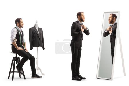 Téléchargez les photos : Jeune homme essayant un costume au magasin de tailleurs isolé sur fond blanc - en image libre de droit