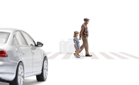 Photo for Full length profile shot of a grandfather crossing street with a child and car approaching isolated on white background - Royalty Free Image
