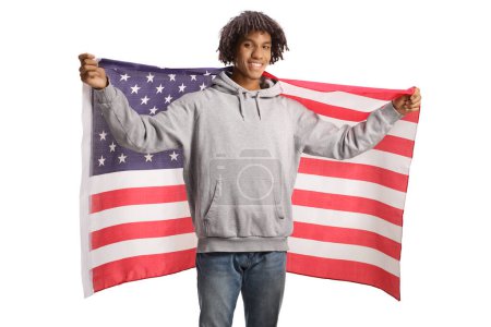 Photo for Young african american man holding a USA flag and smiling isolated on white background - Royalty Free Image