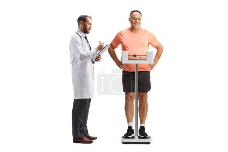 Photo for Mature man in sportswear weighing on a scale and doctor writing a document isolated on white background - Royalty Free Image