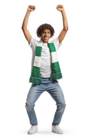 Photo for Happy african american young man cheering with a green and white scarf isolated on white background - Royalty Free Image