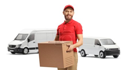 Photo for Delivery man with white vans carrying a cardboard box isolated on white background - Royalty Free Image