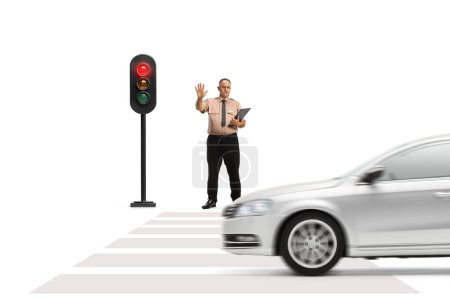Photo for Full length portrait of a security guard gesturing stop with hand at a pedestrian crossing isolated on white background - Royalty Free Image