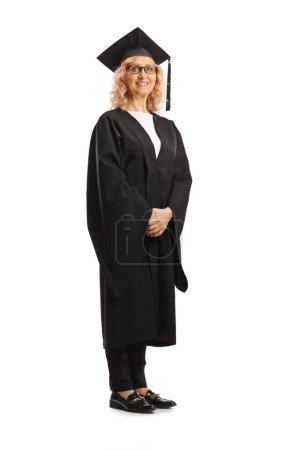 Photo for Full length portrait of a woman in a graduate gown isolated on white background - Royalty Free Image