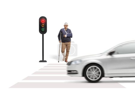 Photo for Injured man with a crutch waiting at a pedestrian crossing isolated on white background - Royalty Free Image