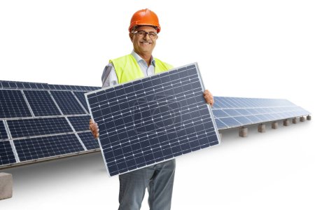 Foto de Ingeniero masculino maduro sosteniendo un panel fotovoltaico aislado sobre fondo blanco - Imagen libre de derechos