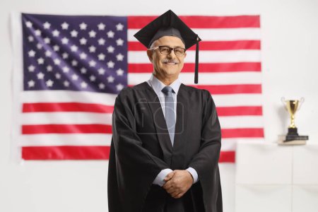 Photo for University dean standing in front of a USA flag - Royalty Free Image