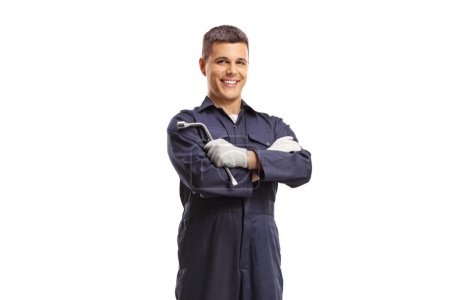Photo for Mechanic holding a wrench and smiling isolated on white background - Royalty Free Image