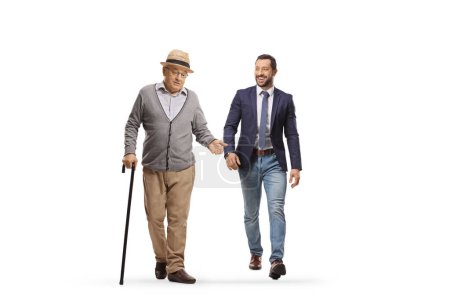 Photo for Elderly man walking and talking to a younger man isolated on white background - Royalty Free Image