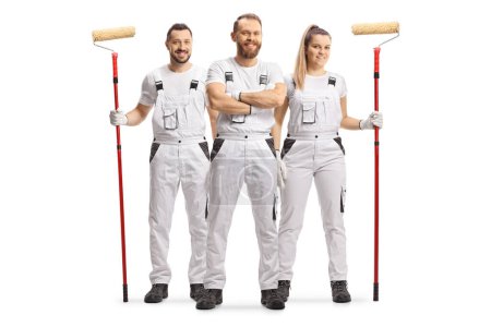 Photo for Male and female house painters in white overall pants smiling at camera isolated on white background - Royalty Free Image
