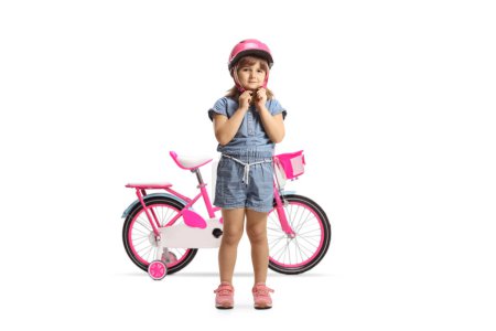 Photo for Full length portrait of a girl with a bicycle putting on a helmet isolated on white background - Royalty Free Image