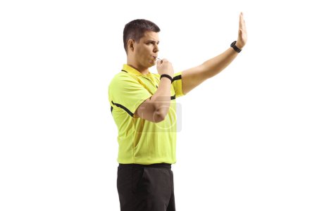 Photo for Football referee blowing a whistle and gesturing stop isolated on white background - Royalty Free Image