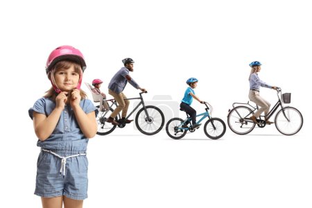 Photo for Family riding bicycles and a girl standing and putting on a helmet isolated on white background - Royalty Free Image