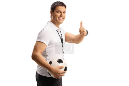 Photo for Football coach holding a ball and gesturing thumbs up isolated on white backgroun - Royalty Free Image