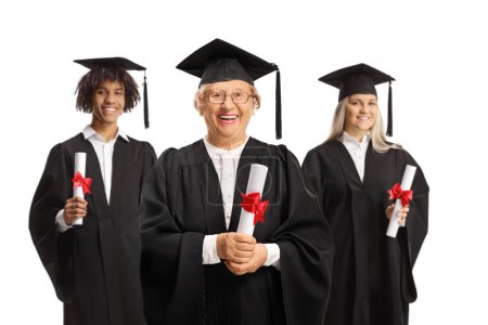 Photo for Proud graduate students and an elderly woman holding certificates and smiling isolated on white background - Royalty Free Image