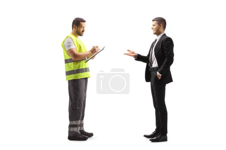 Photo for Road assistance worker in a reflective vest writing a document and talking to a businessman isolated on white background - Royalty Free Image