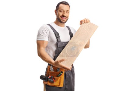 Photo for Carpenter holding a wooden floor beam isolated on white background - Royalty Free Image