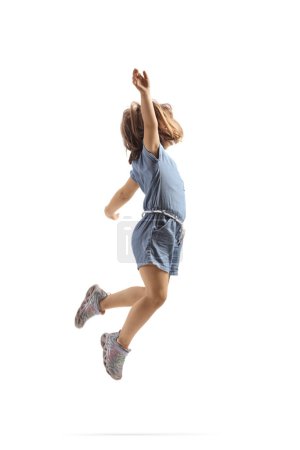 Foto de Feliz niña saltando en el aire aislado sobre fondo blanco - Imagen libre de derechos